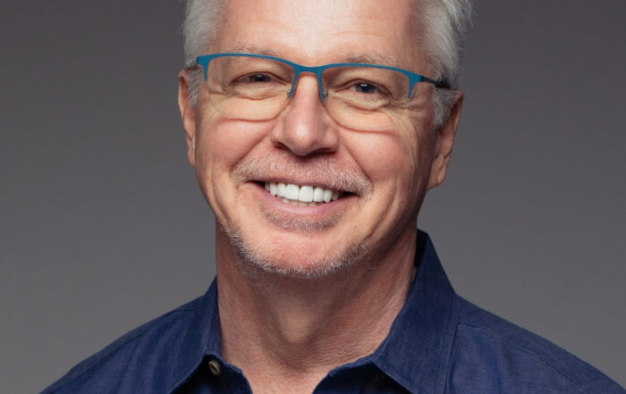Michael Walsh smiling headshot, business growth expert and author of Freedom by Design